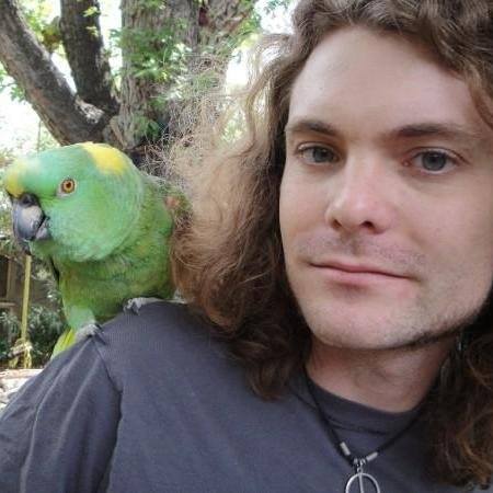 Tweed Jefferson (Junction City Council) with a parrot on his shoulder